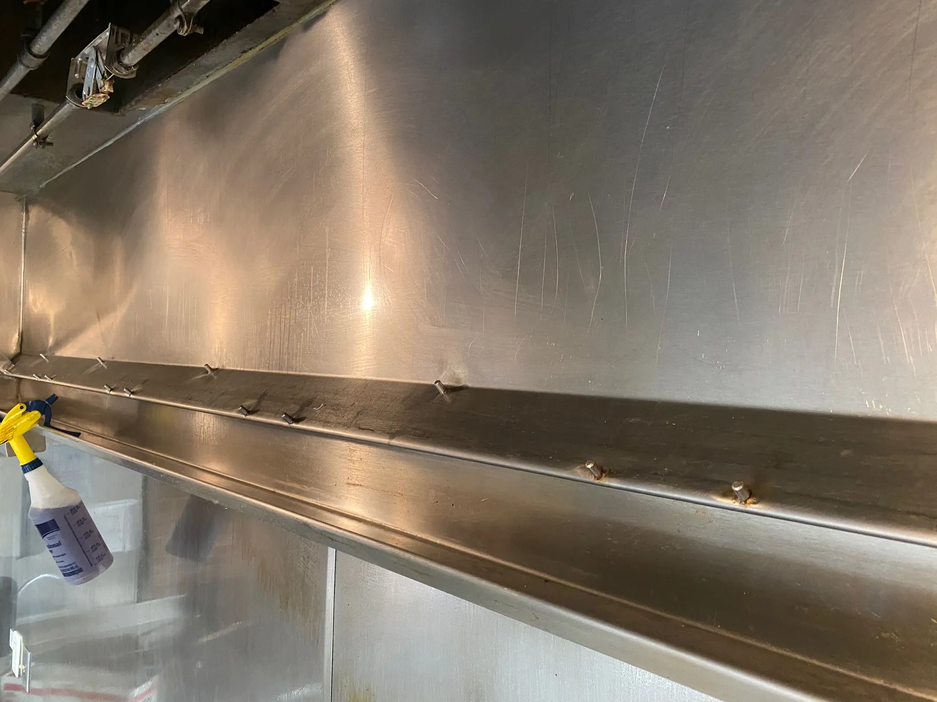 Commercial vent hood being prepared for cleaning